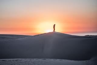 Man standing on mountain peak Man standing on mountain peak